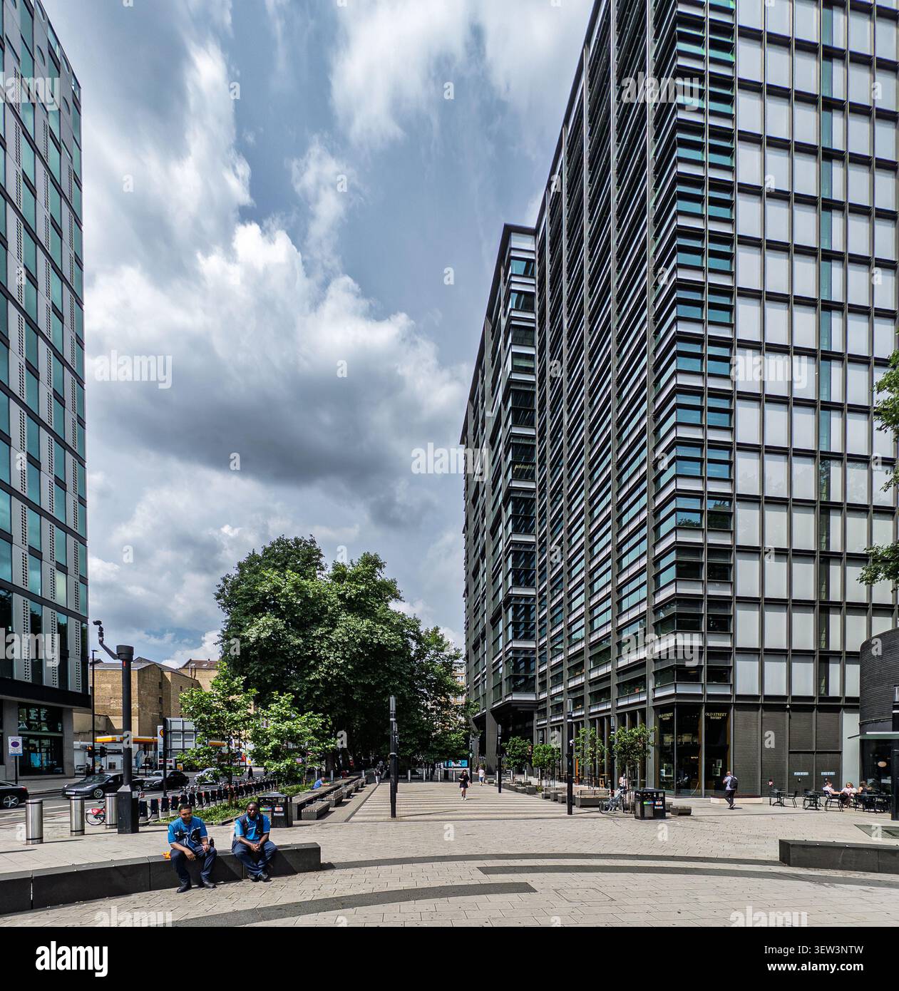 View looking away from Old Street Tube station across the redeveloped plaza and modern office towers at Old Street junction in London - Smartphone Captured Stock Image