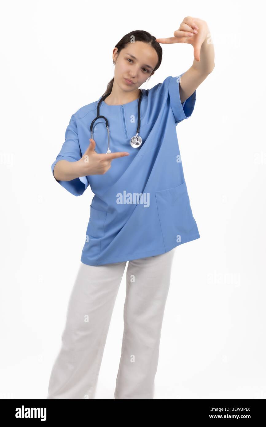 Professional female medical doctor posing inside studio environment Stock Photo