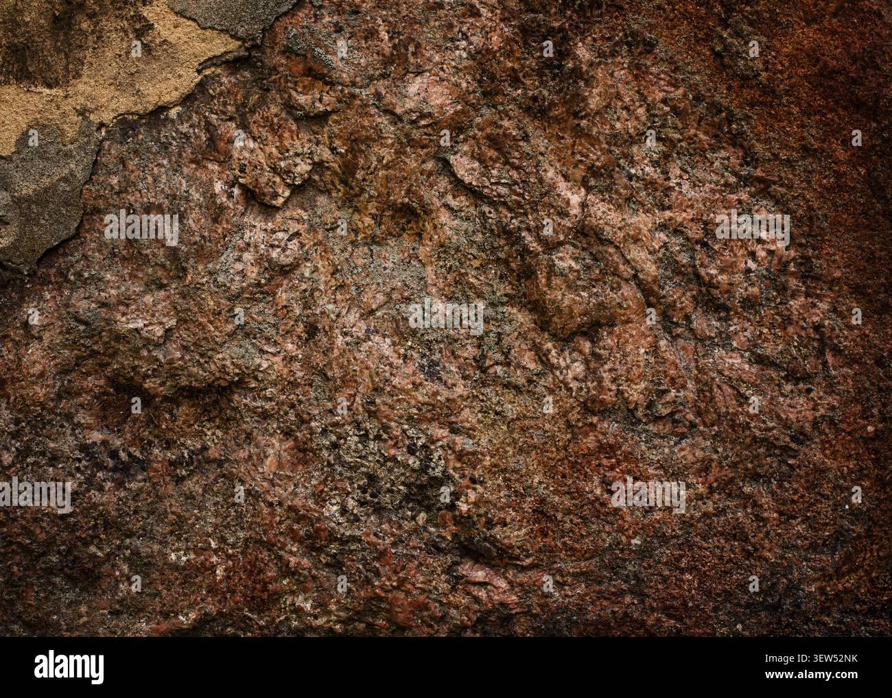 Rough natural red granite stone wall texture background Stock Photo