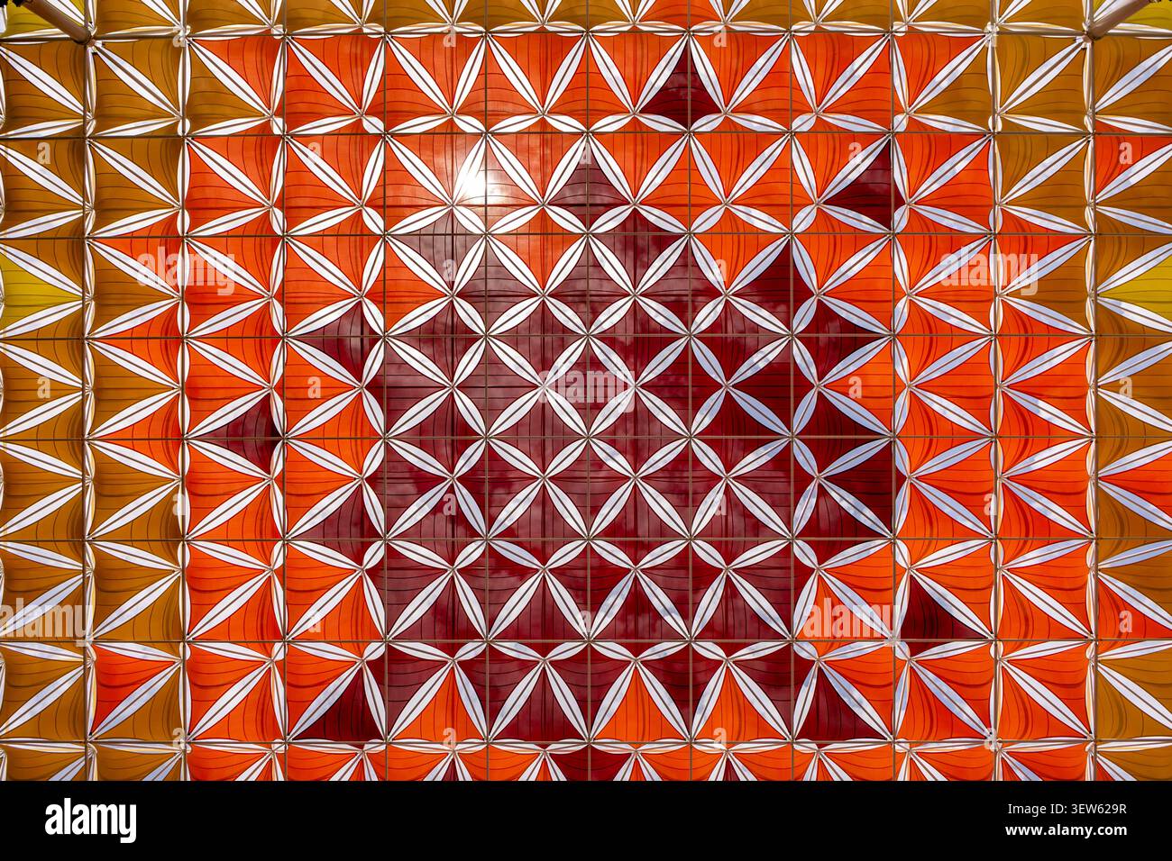 Abstract geometric pattern with vibrant orange and red architectural design Stock Photo