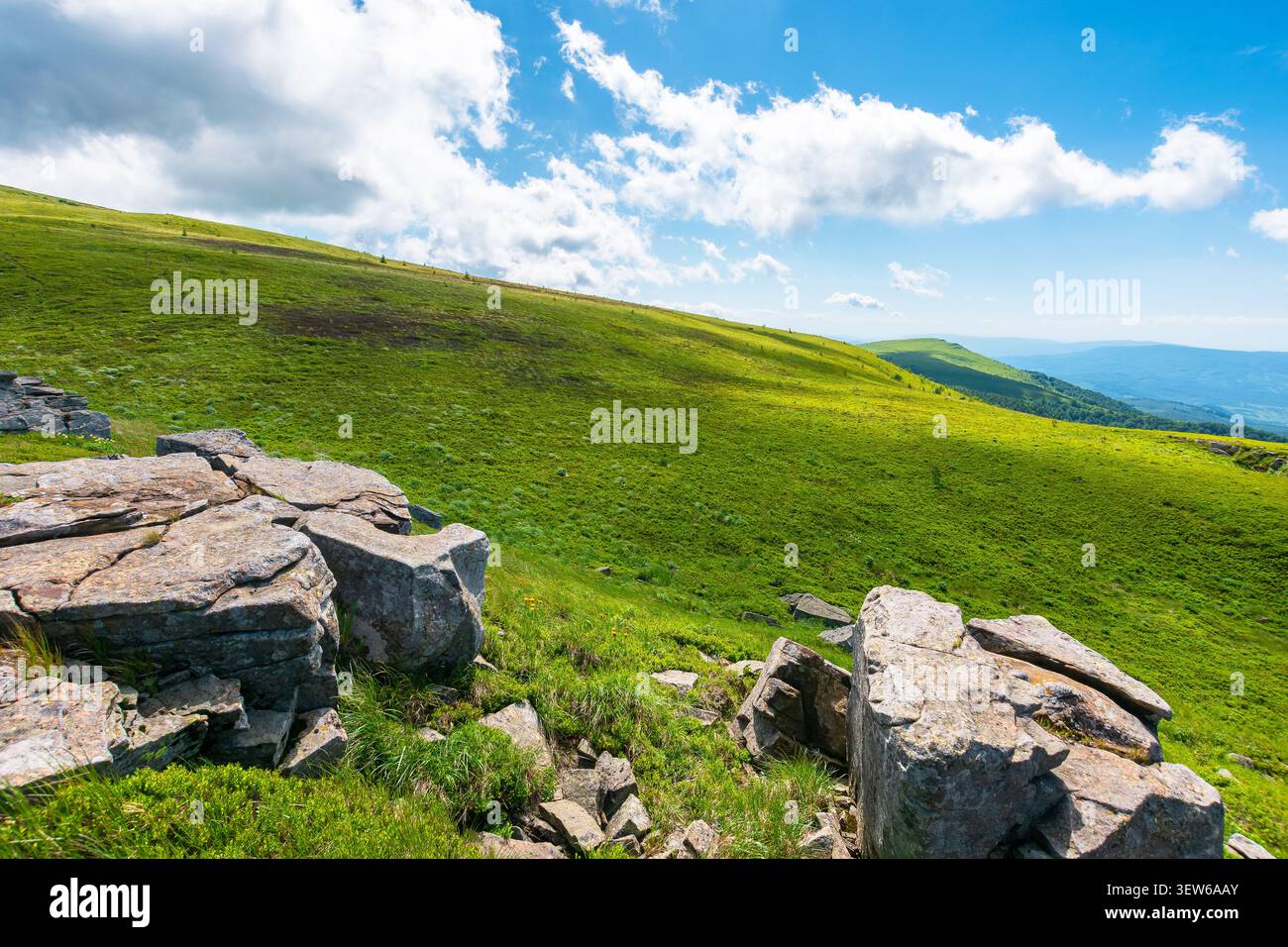 carpathian mountain landscape in summer. amazing background for outdoor adventure. transcarpathia green hill with rocks. sunny day with blue sky Stock Photo