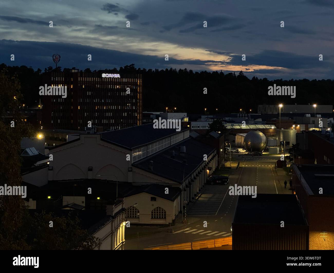 Scania truck factory in Södertälje illuminated at night, showcasing modern industrial production, logistics and Swedish manufacturing. - Smartphone Captured Stock Image