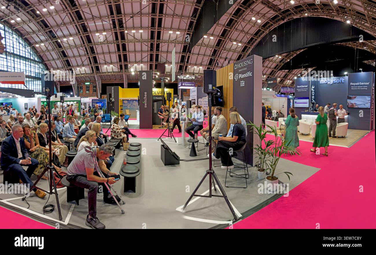 SocialHousing Conference audience watching a Plentific housing technology presentation at Housing 2026 in Manchester Central hall Stock Photo
