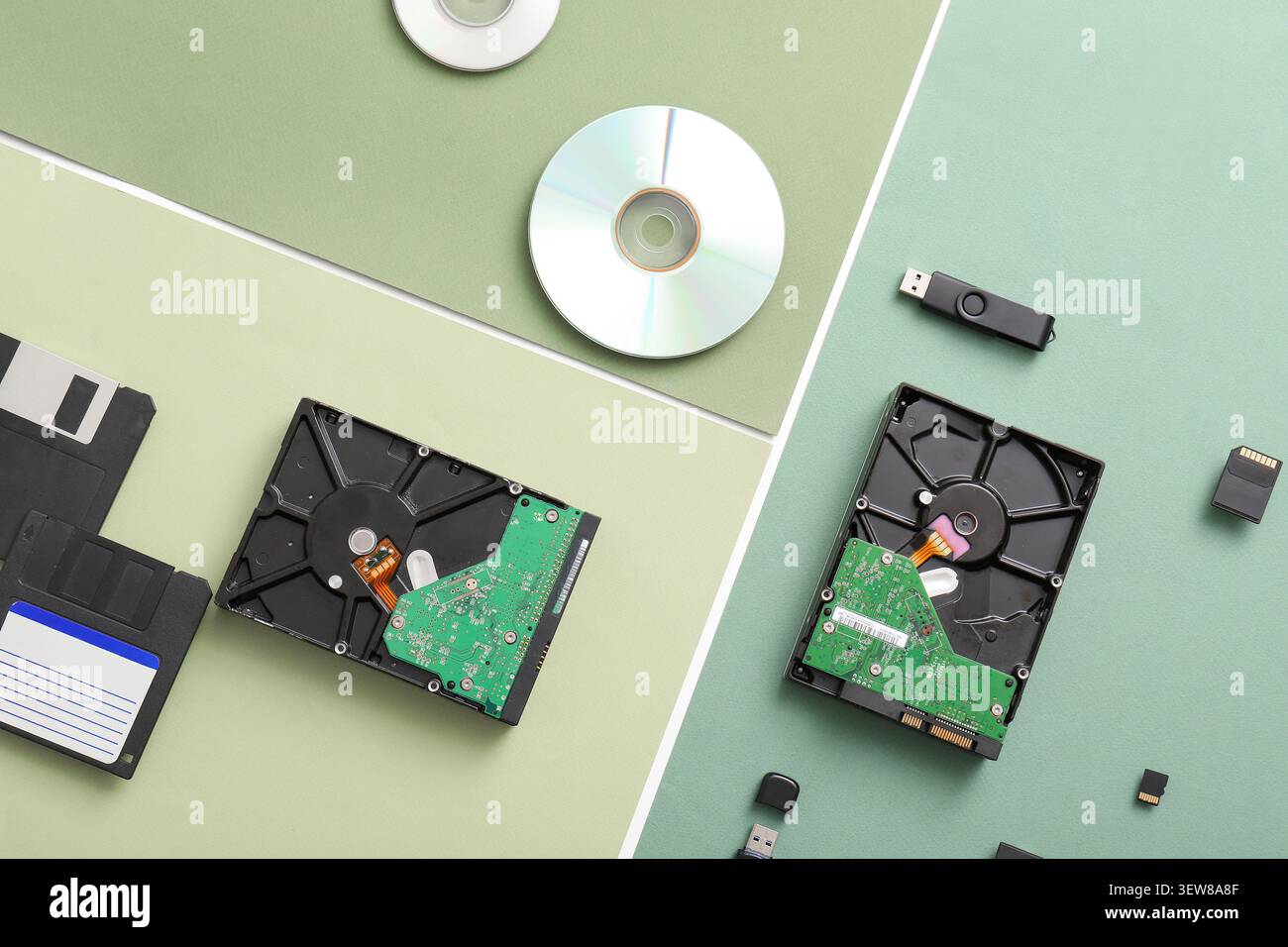 Various computer storage devices on colored backgrounds Stock Photo