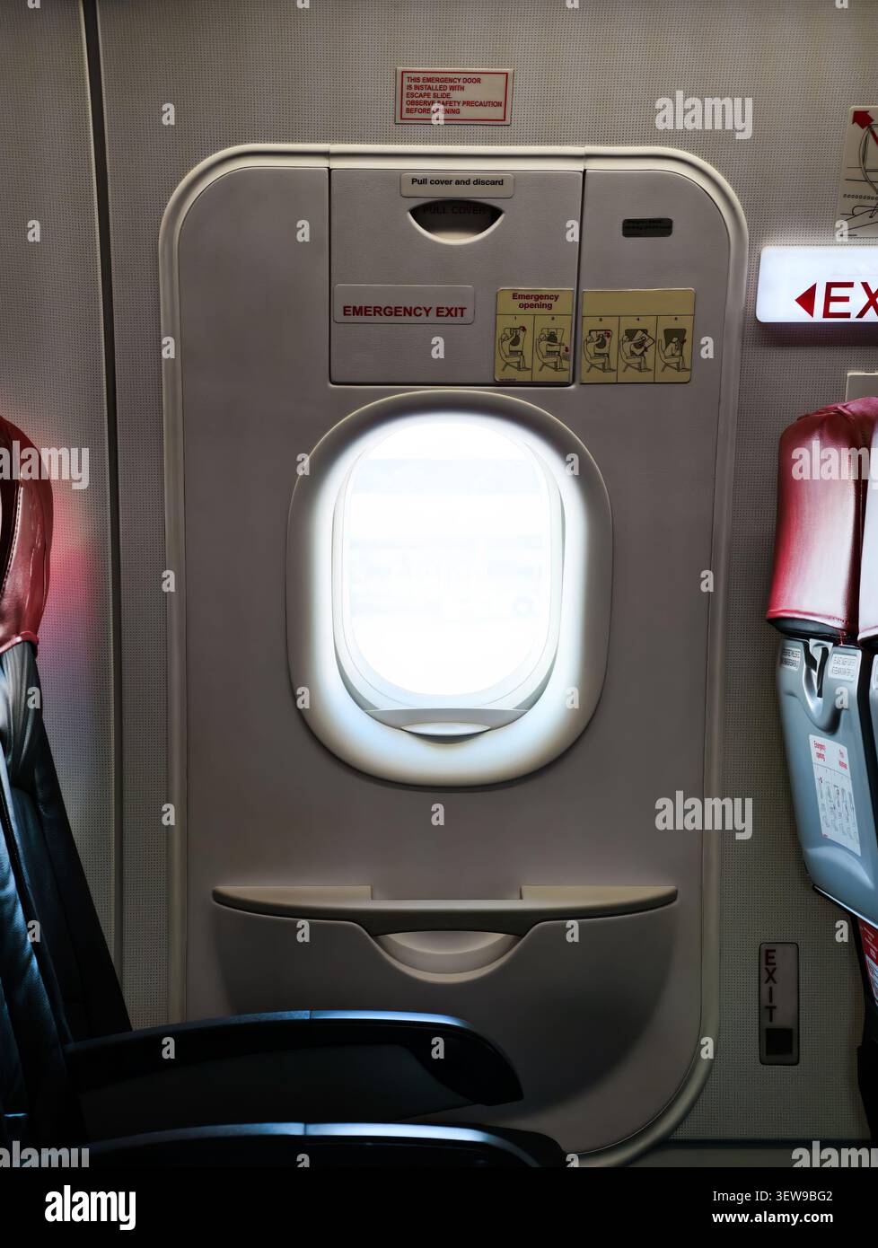 emergency exit door on an airplane Stock Photo
