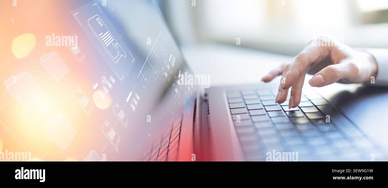 Document management system for organizing business workflows and digital file access using laptop typing Stock Photo