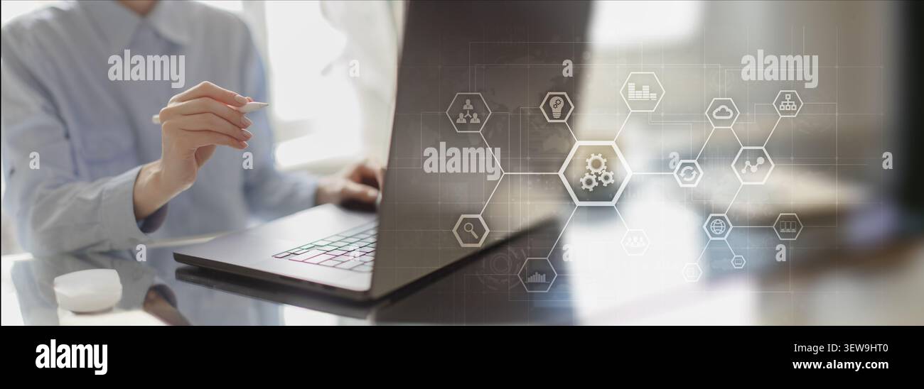 Robotic process automation system for enterprise workflow efficiency with human interaction on laptop Stock Photo