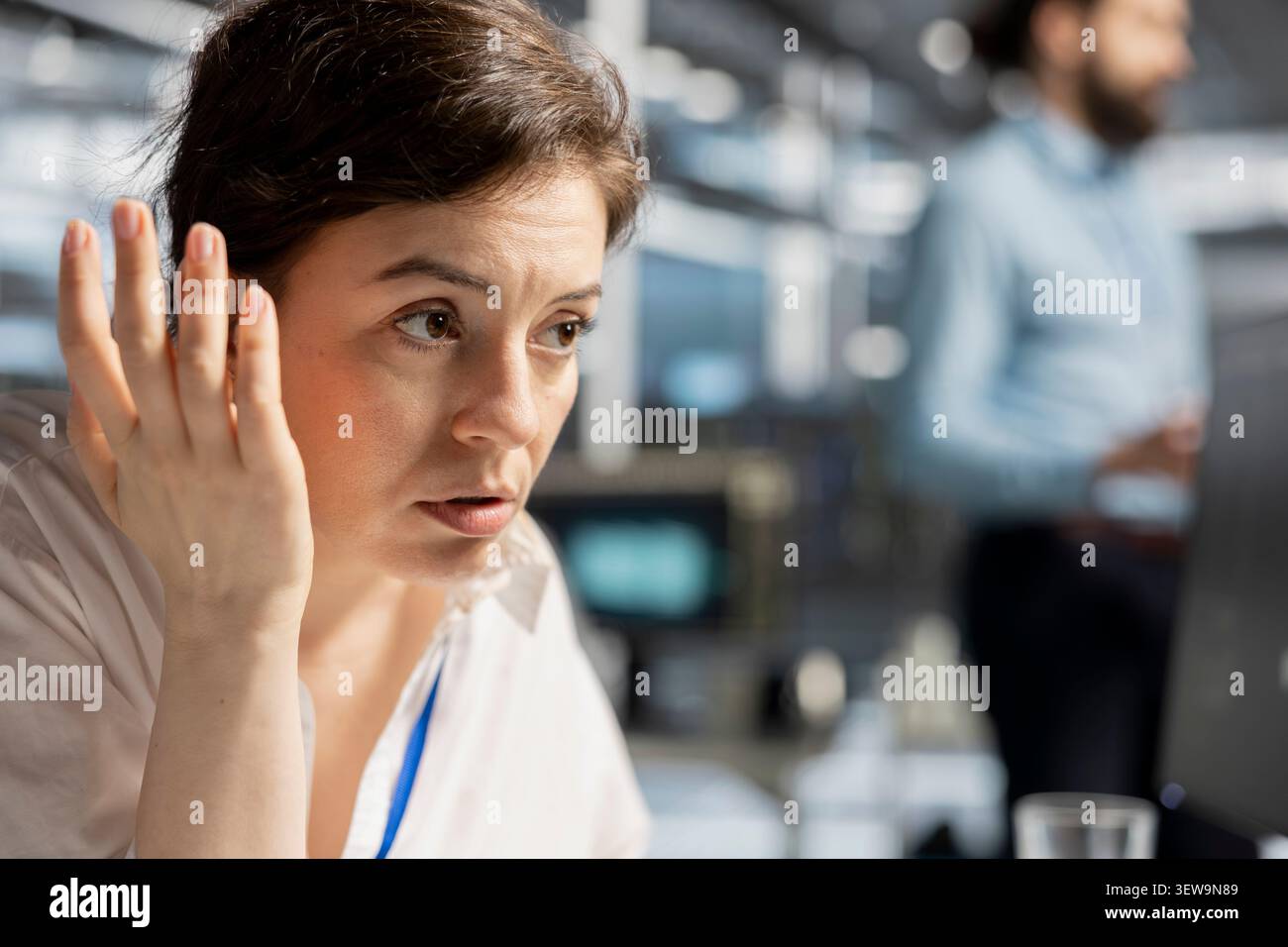 System administrator inspects server infrastructure, performs maintenance checks and reviews equipment diagnostics. Stock Photo