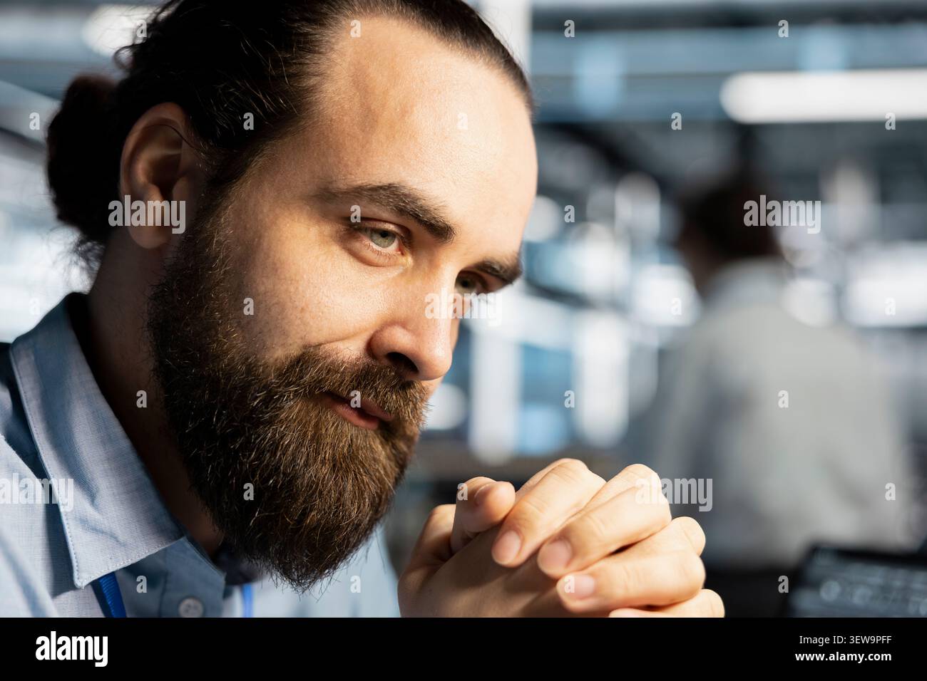 Data center engineer inspects server infrastructure, performs maintenance checks and reviews equipment diagnostics. Stock Photo