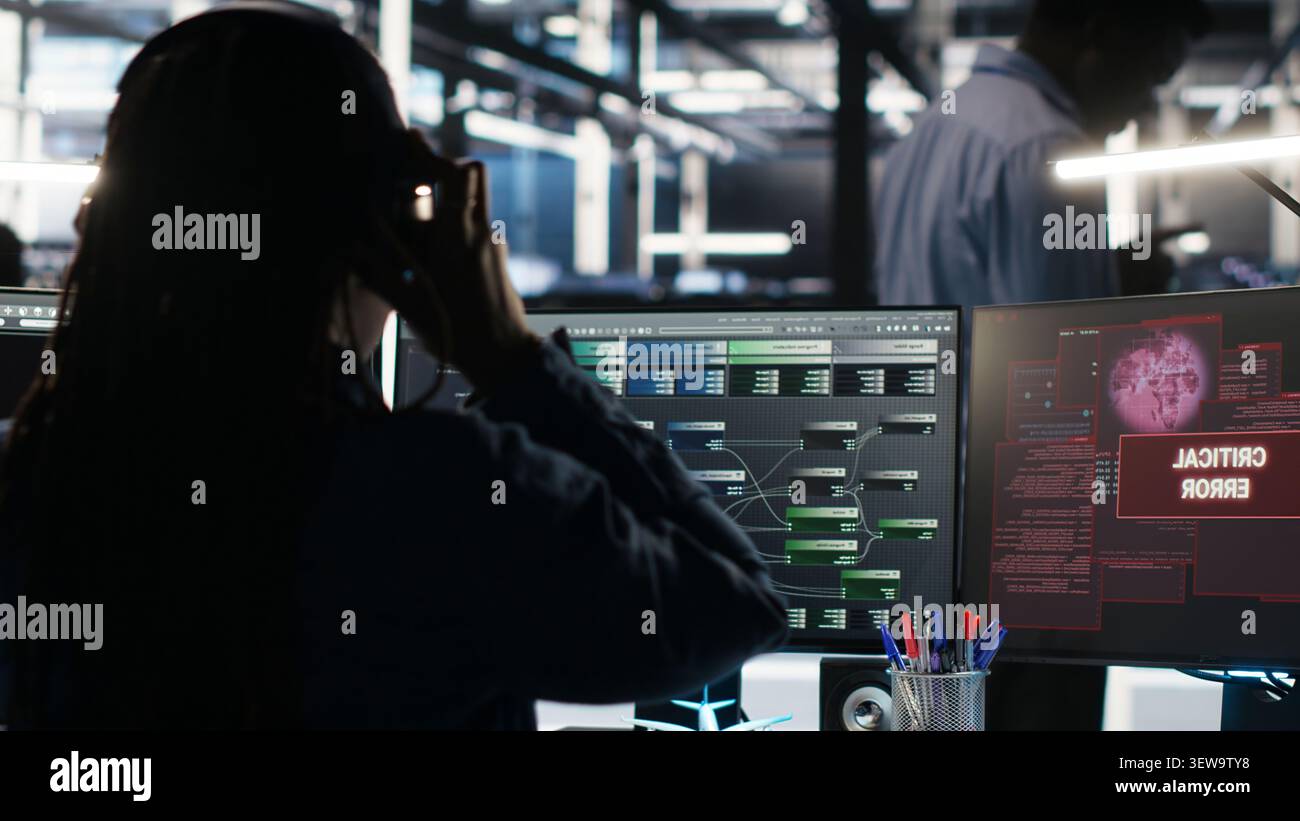 Data center engineer uses node tree software to identify equipment performance issues and data patterns. Stock Photo
