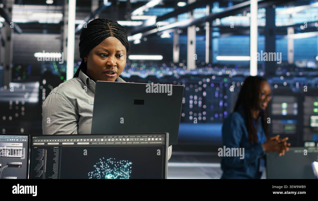 Frustrated data center worker reacts to malfunctioning node tree software and technical errors during AI analysis. Stock Photo