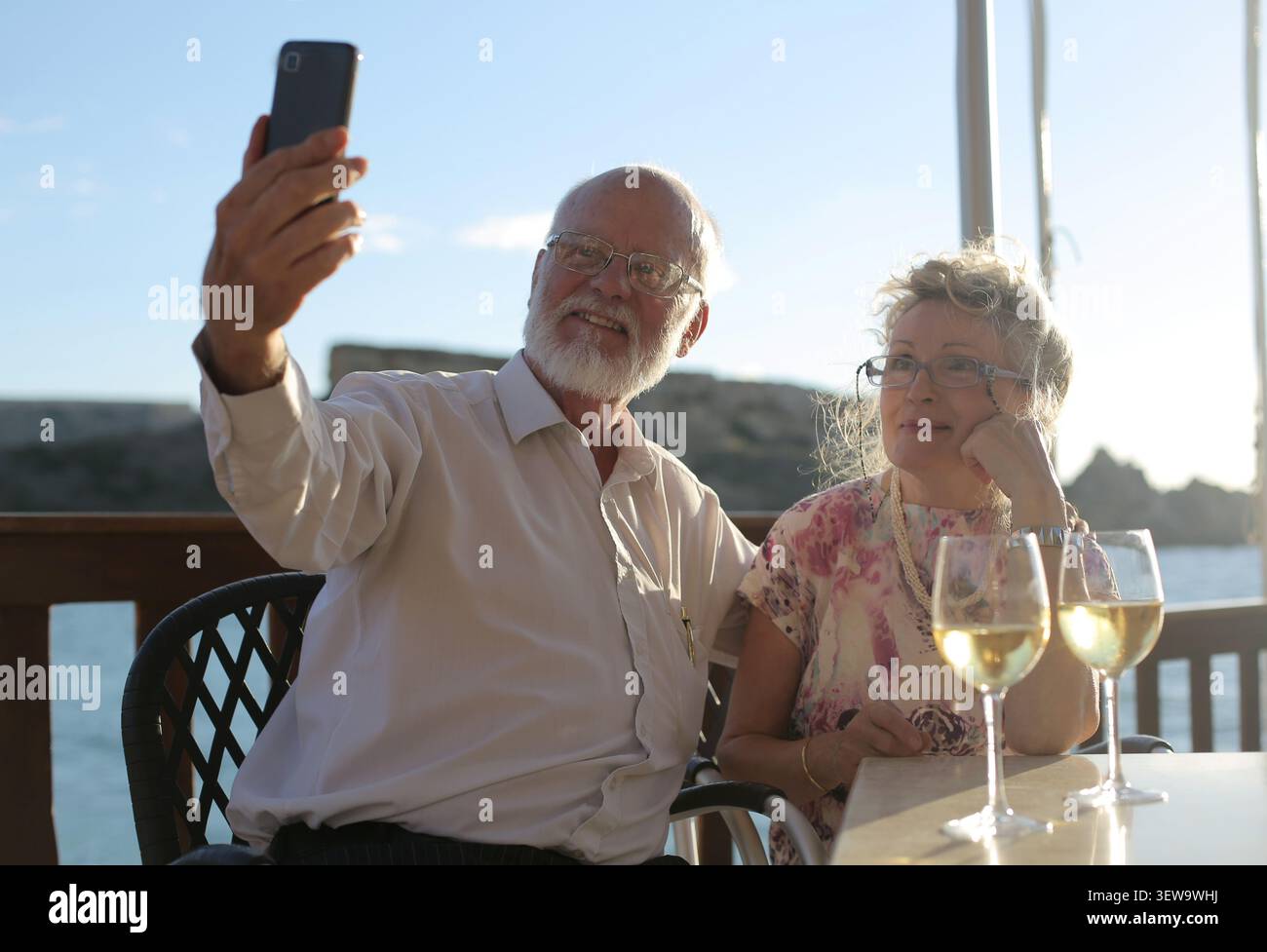 Happy senior couple taking a selfie on a date Stock Photo