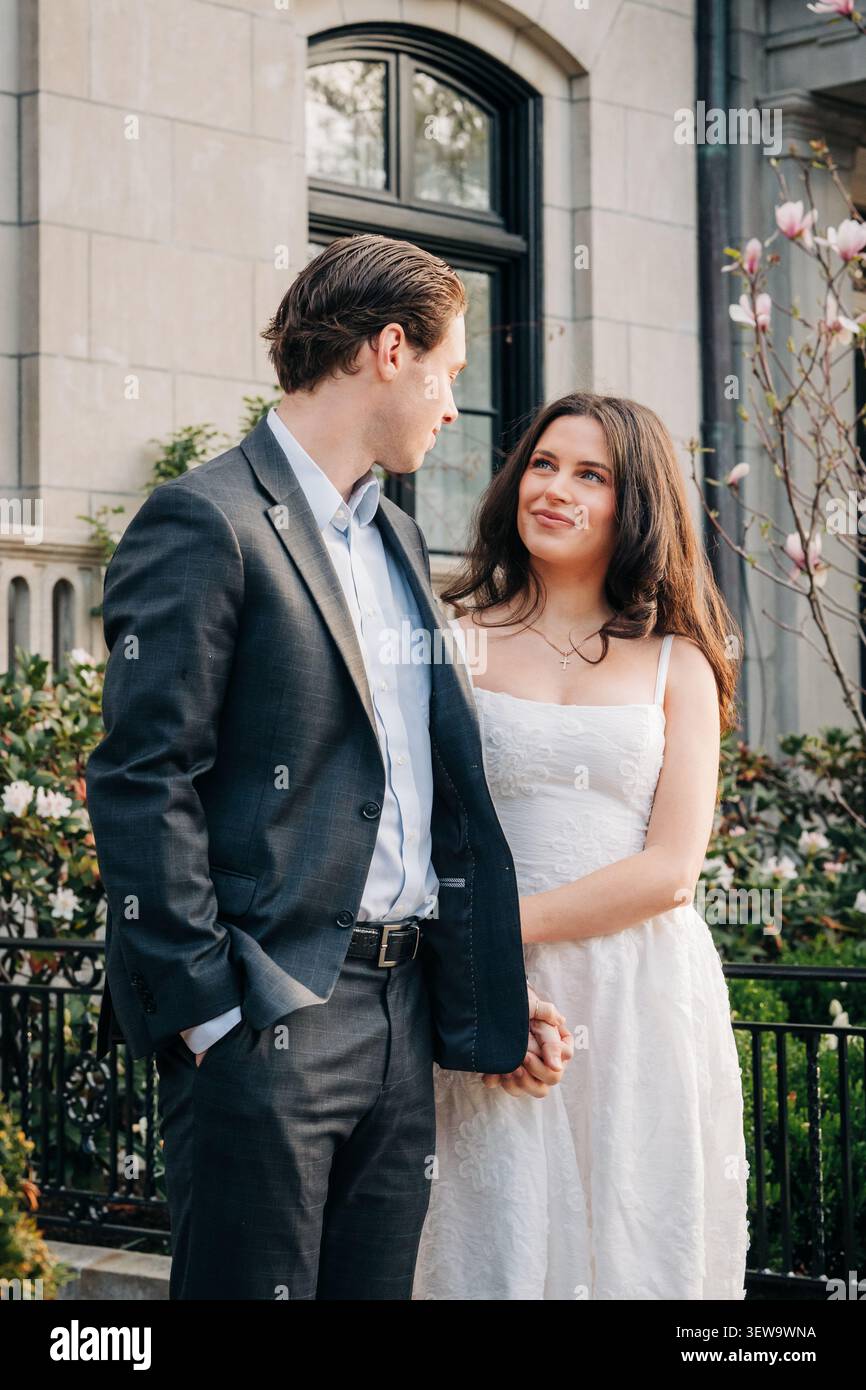 Young romantic couple gazing at each other lovingly Stock Photo