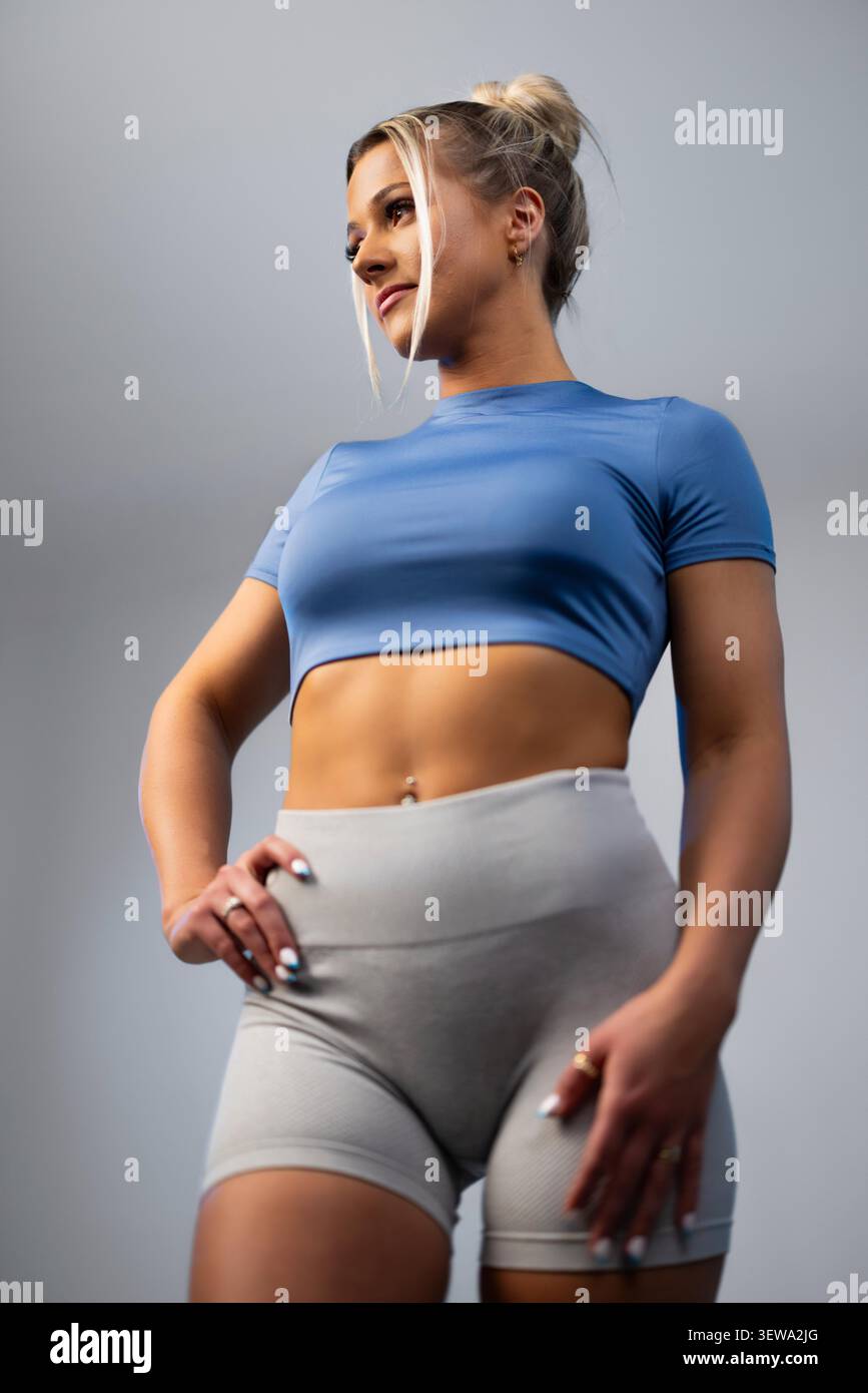 Woman in blue top leggings hi-res stock photography and images - Alamy