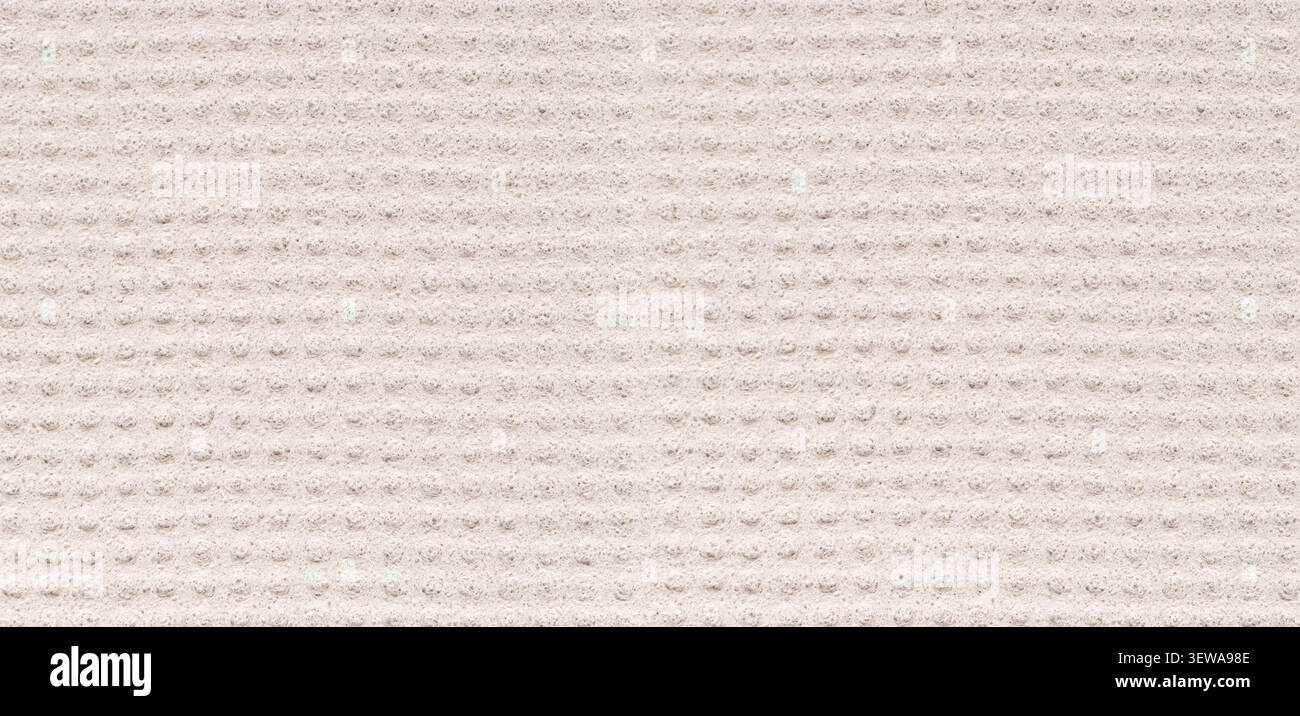 Light gray fabric showing a textured surface with repeating dots pattern Stock Photo