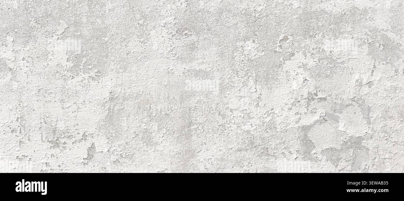 Grungy white concrete plastered wall texture creating abstract background Stock Photo