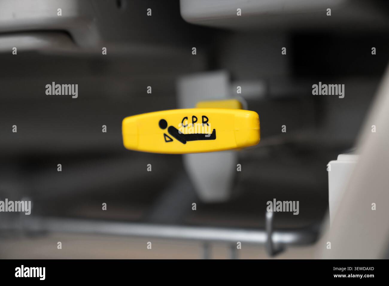 Hospital bed CPR release lever in a modern medical facility. Essential safety feature for emergency care and rapid life support response. Stock Photo