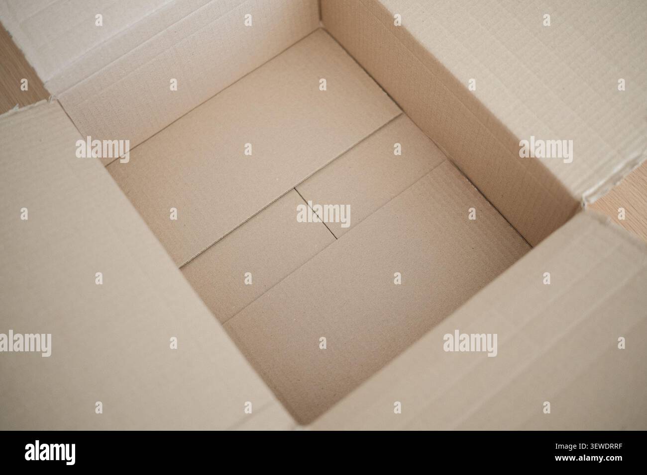 Open empty brown cardboard box for delivery package Stock Photo