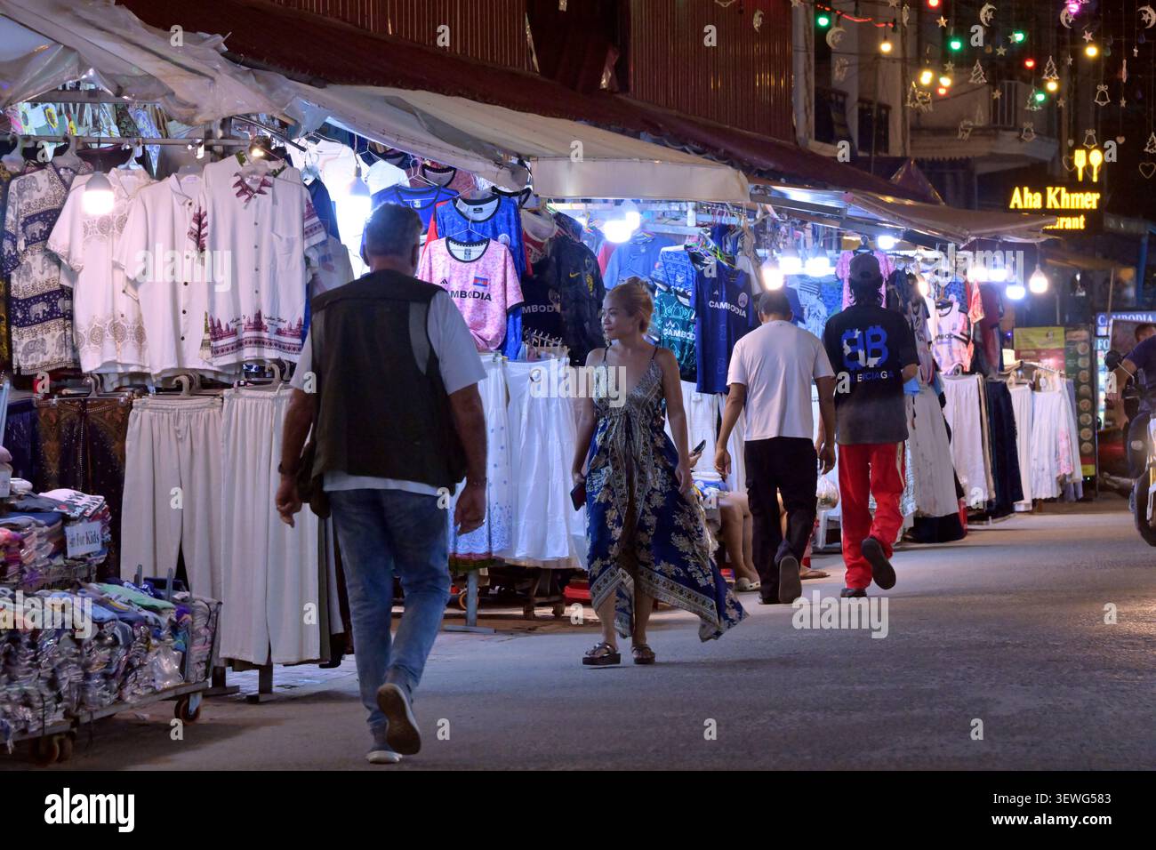 Tourists and locals shop at one of the night markets in Siem Reap, Cambodia. Stock Photo