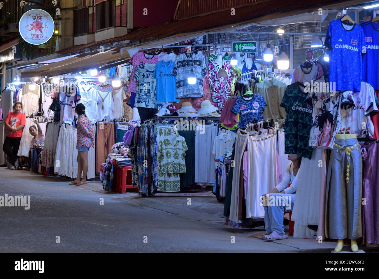 Tourists and locals shop at one of the night markets in Siem Reap, Cambodia. Stock Photo