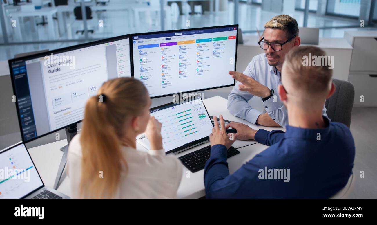 Human Resources Manager Leads Diverse Team Using HR Software Daily Tasks Stock Photo