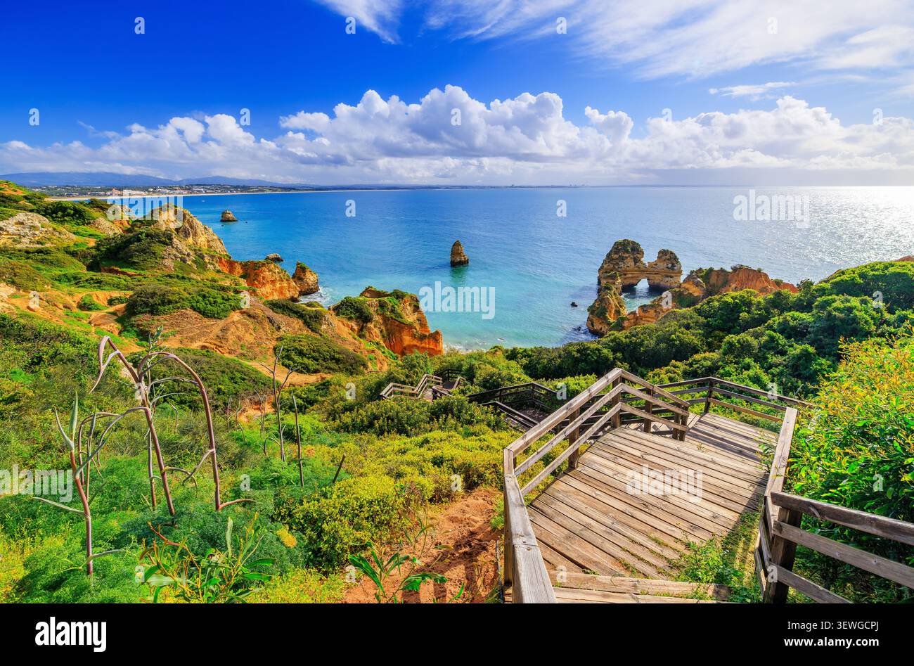 Algarve, Portugal. Costa de Oiro (Golden Coast). Wooden footbridge to beautiful beach Praia do Camilo near Lagos. Stock Photo