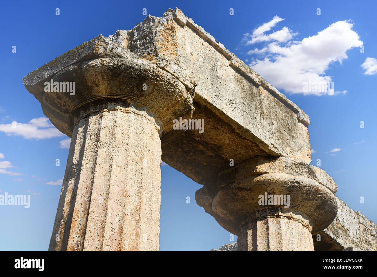 Ancient Doric columns from the Temple of Apollo in Corinth, Greece Stock Photo