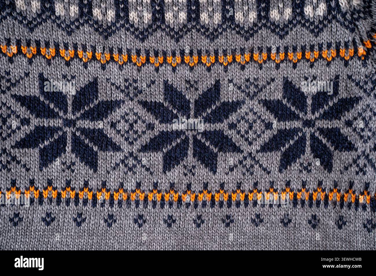 Nordic Knit Pattern Background. Texture Christmas gray sweater Stock Photo