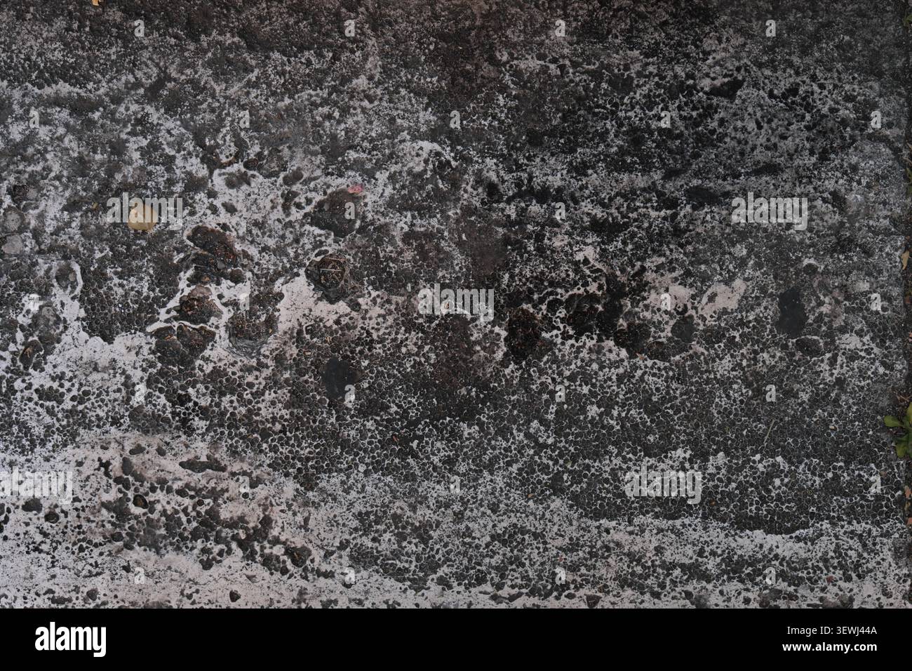 ABSTRACT BACKGROUND TEXTURE OLD CRACKED ASPHALT PAVEMENT Stock Photo