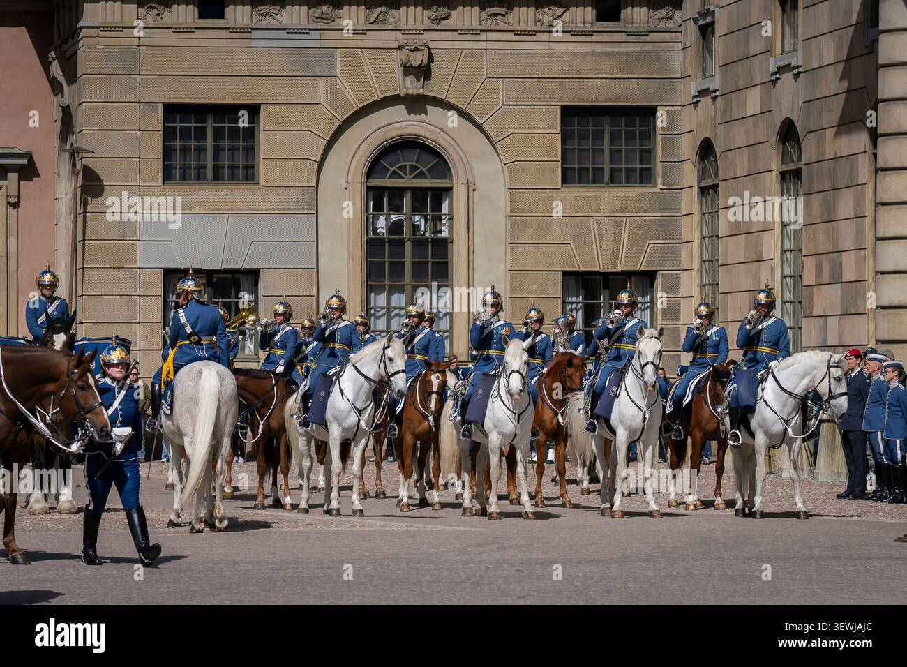 Mounted soldiers of the Swedish Royal Guard take part in the ceremonial Changing of the Guard at the Royal Palace in Stockholm. Stock Photo