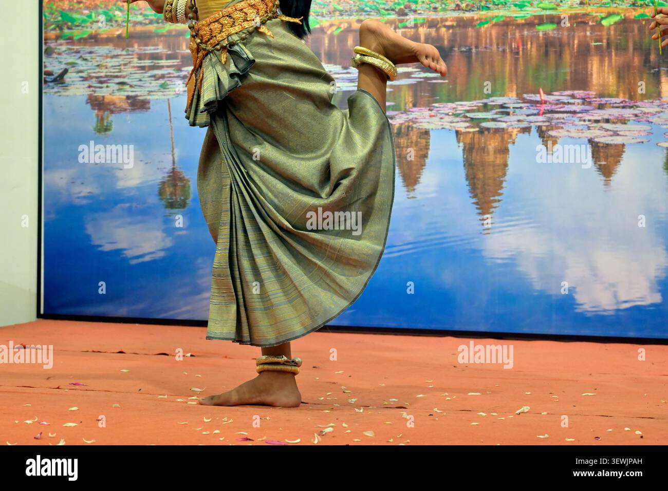 A Cambodian lady demonstrates her footwork technique during traditional Hindu apsara dancing. Stock Photo