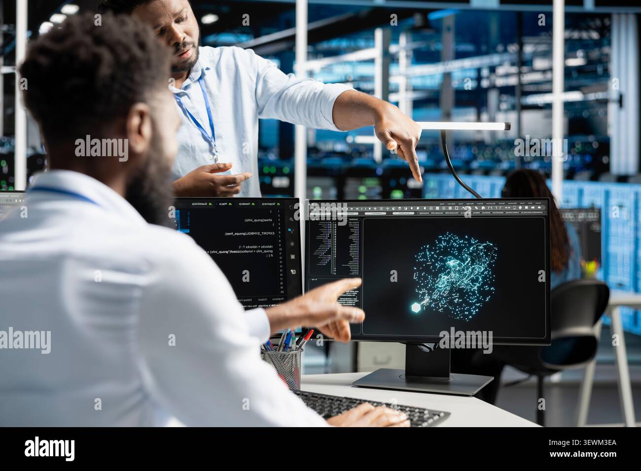 Data center manager reviews artificial intelligence systems and machine learning processes inside a data center. Stock Photo