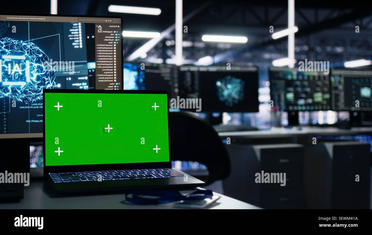 IT specialist reviews neural network visualization on green screen computers in a server room during software debugging work. Stock Photo