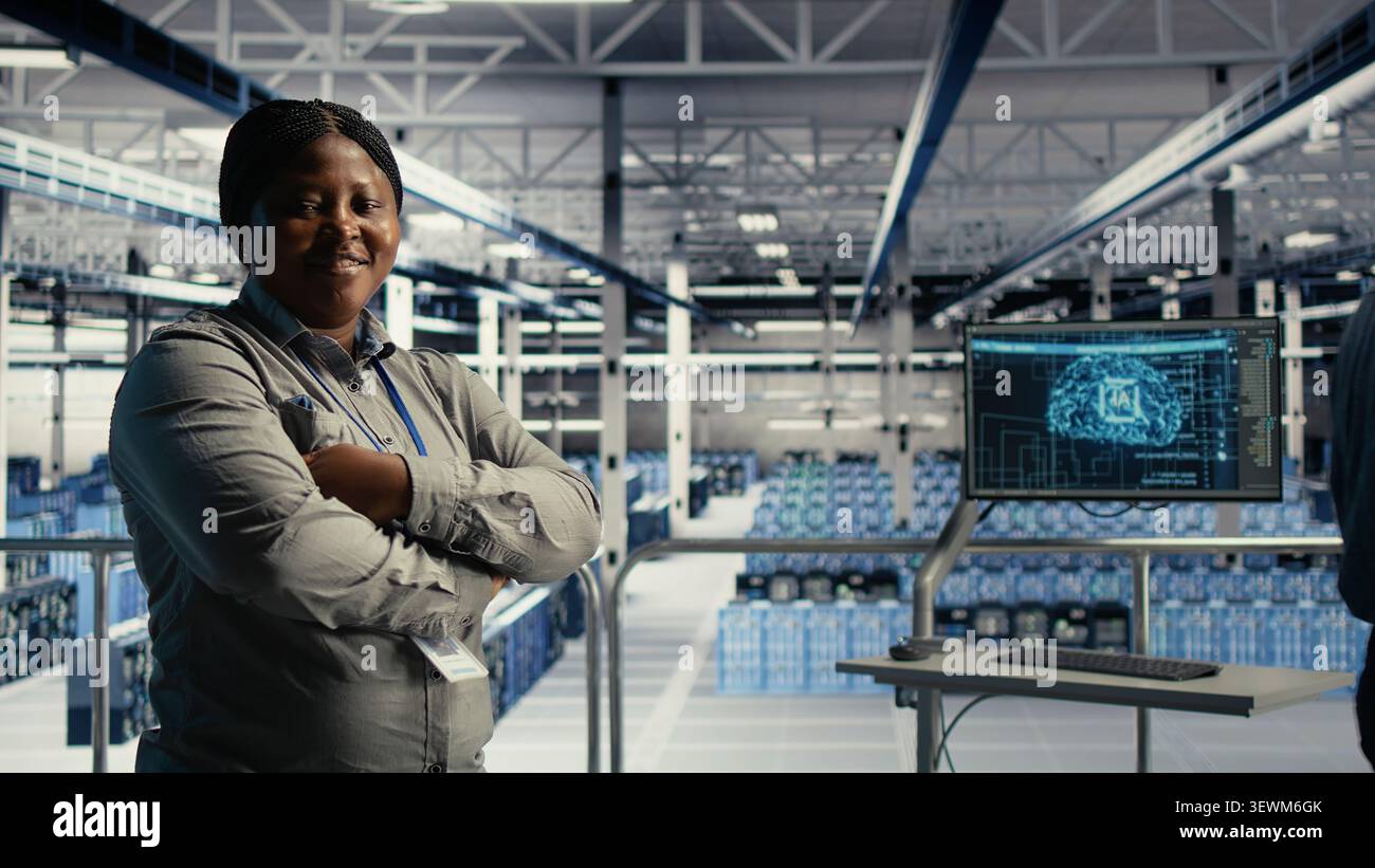 Data center colleagues use digital device deep learning tools in a server room to improve AI operations and system efficiency. Stock Photo
