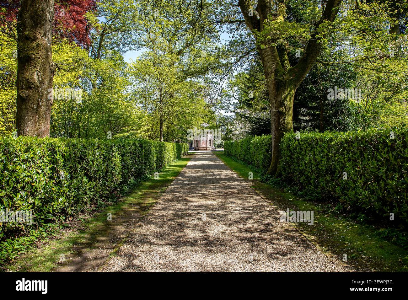 Path leading to the Temple at Larmer Tree Gardens in Wiltshire UK where couples give wedding vows surrounded by beautiful gardens Stock Photo