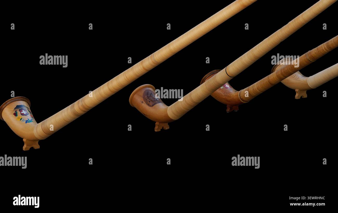 Detailed view of wooden alpine musical instruments with custom paintings against black Stock Photo
