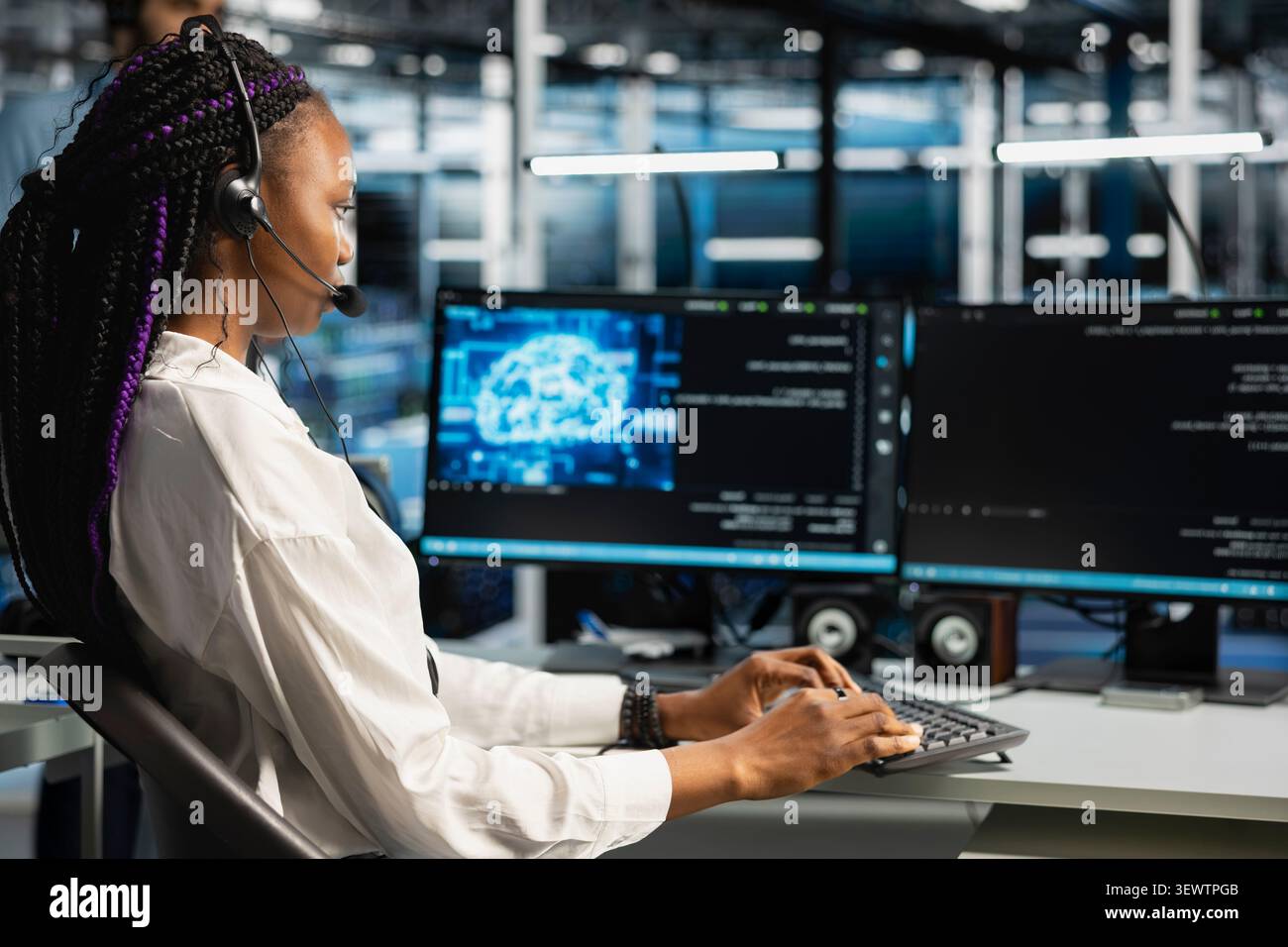 Administrator wears a headset in a server hub, using artificial intelligence troubleshooting to assist users. Stock Photo
