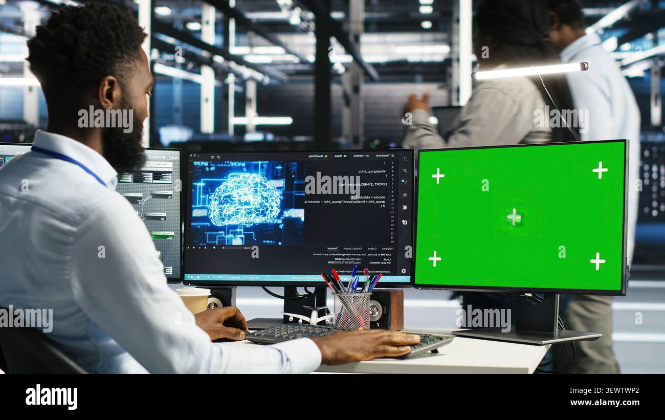Data center administrator uses node tree software to identify equipment performance issues and data patterns. Stock Photo