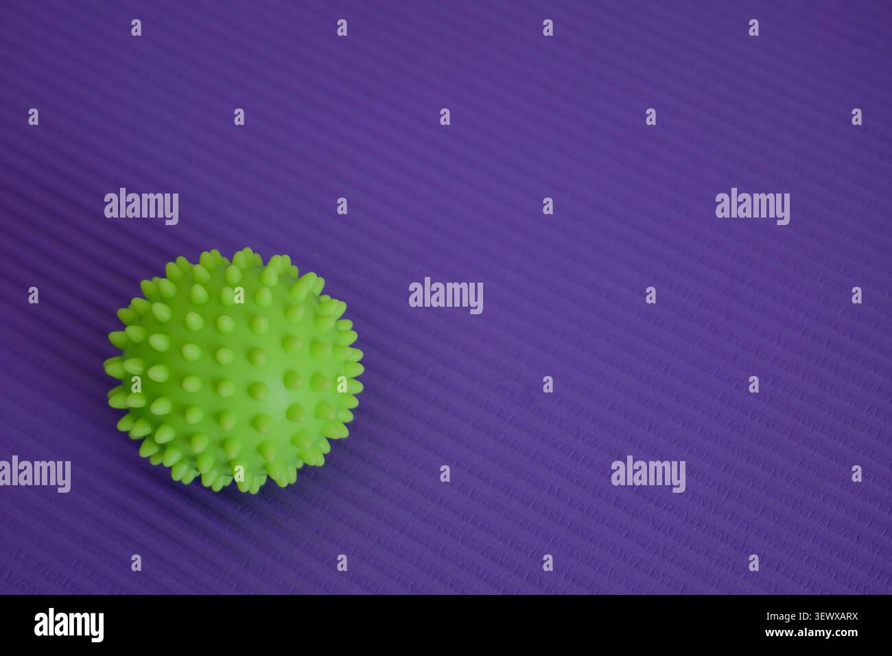 Massage Ball on Exercise Mat Stock Photo