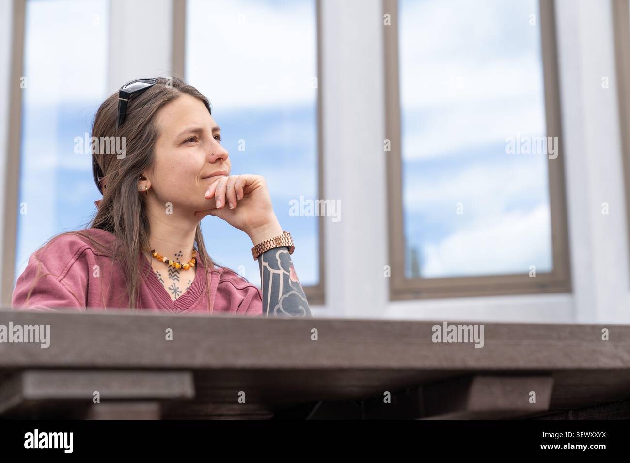 Young woman thinking contemplating future looking away Stock Photo