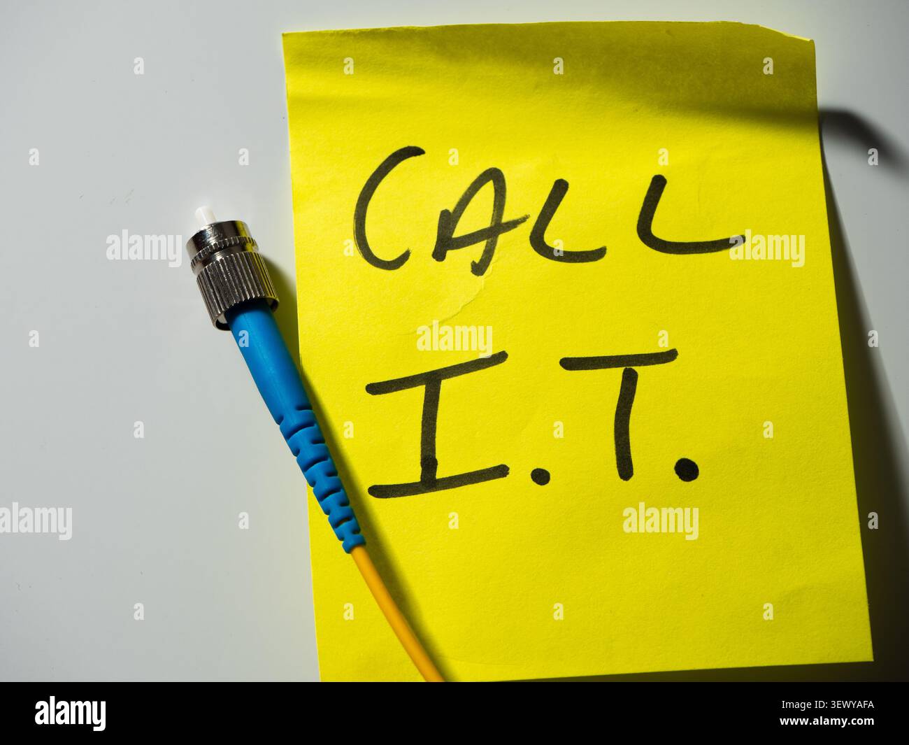Reminder note to call network technician Stock Photo
