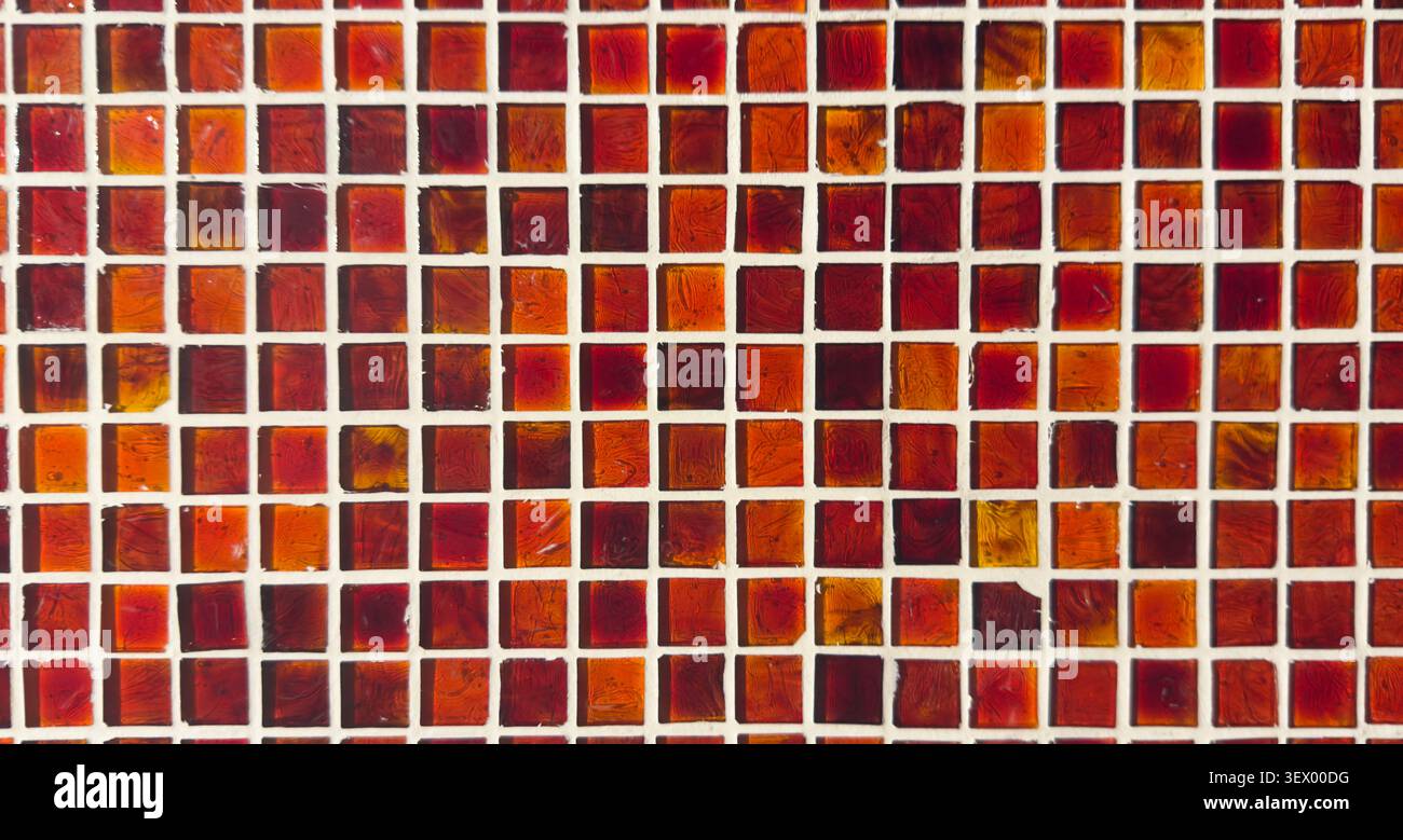 Red glass mosaic tile pattern background with geometric design Stock Photo