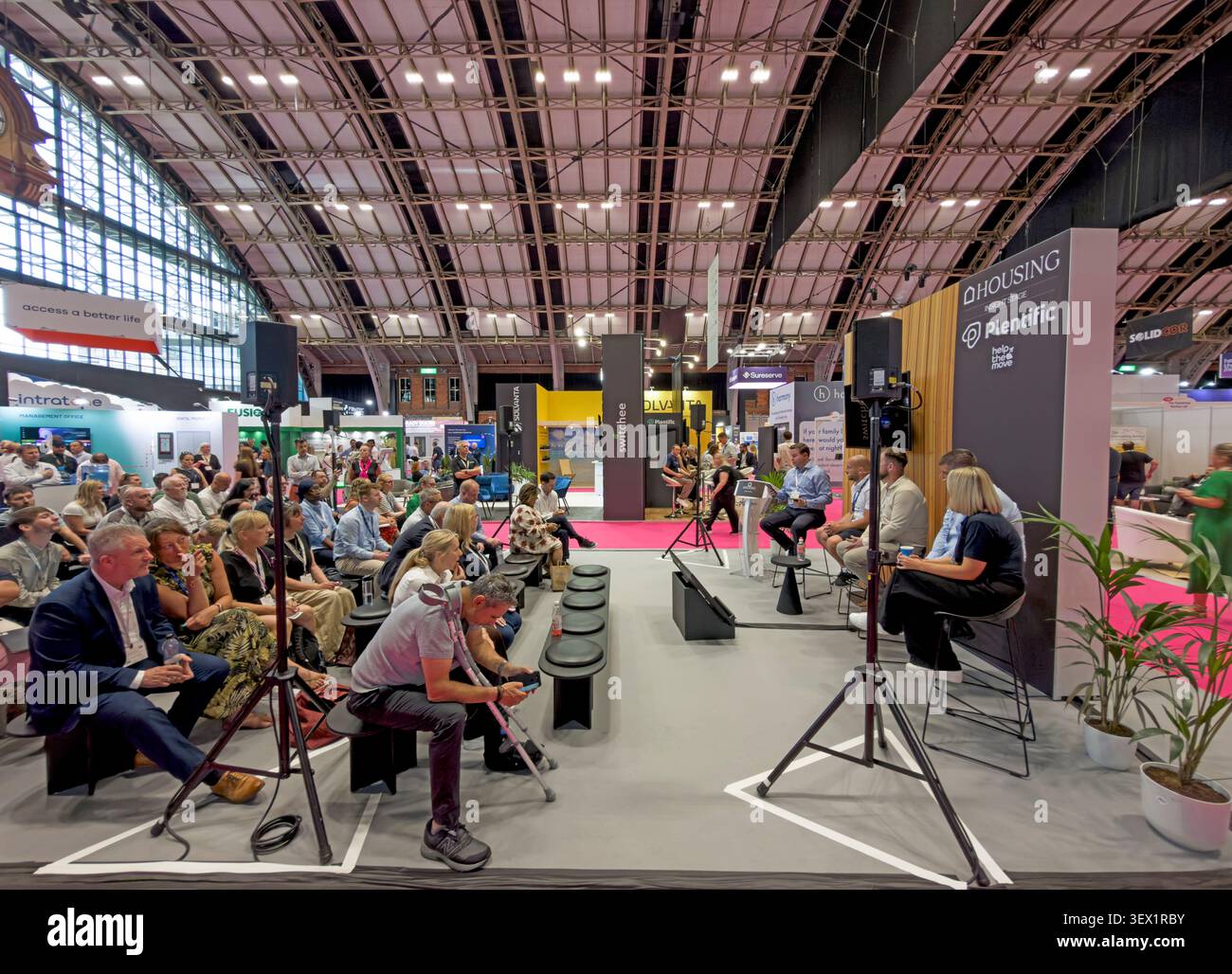 Plentific Staithe exhibition stand and presentation at a UK housing conference and exhibition, Manchester Central, England, Stock Photo