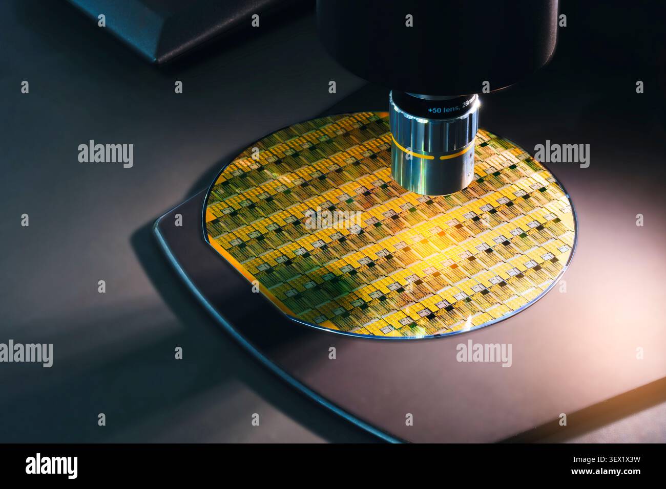 Close-up of a silicon wafer under microscopic inspection. Colorful interference patterns reveal intricate chip structures. Metallic microscope compone Stock Photo