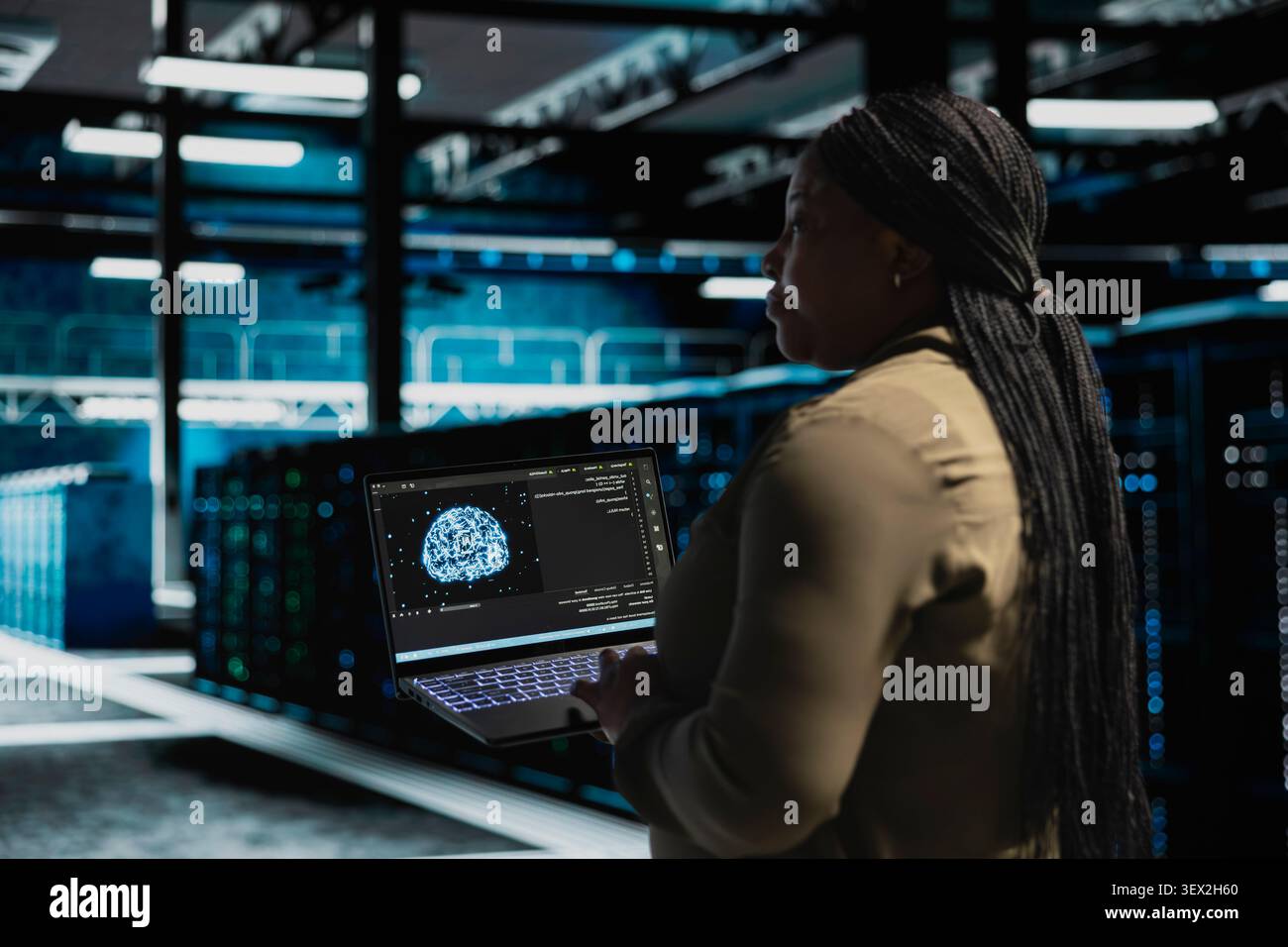 Programmer works with a digital device in a server hub to support artificial intelligence systems. Stock Photo