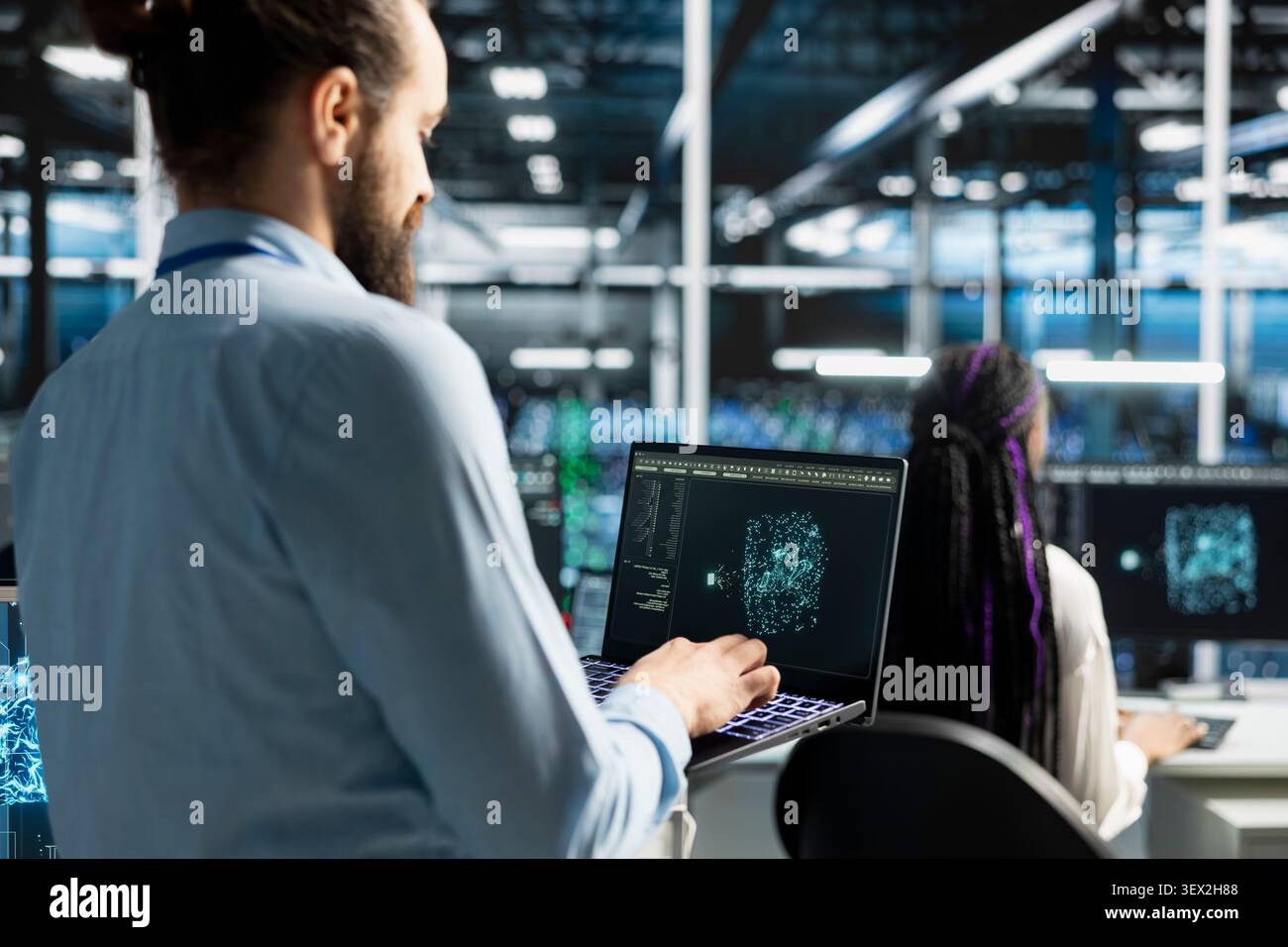 Software developer uses an AI language model assistant in a server hub to handle infrastructure maintenance. Stock Photo