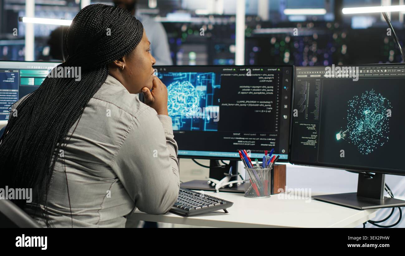System administrator uses machine learning node tree software to analyze infrastructure in a data center. Stock Photo
