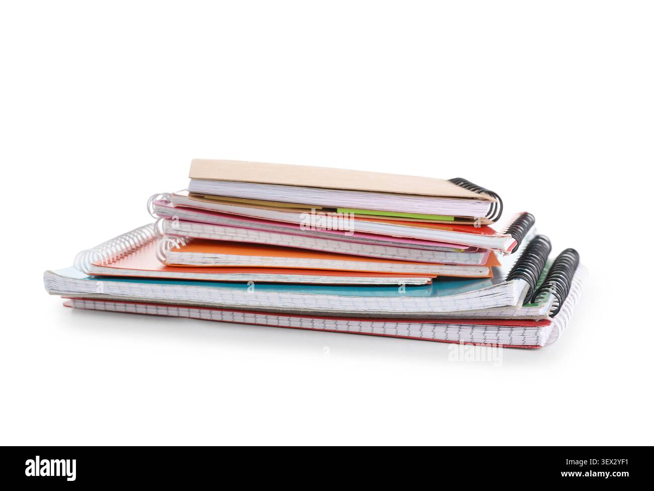 Stack of many different notebooks isolated on white background Stock Photo