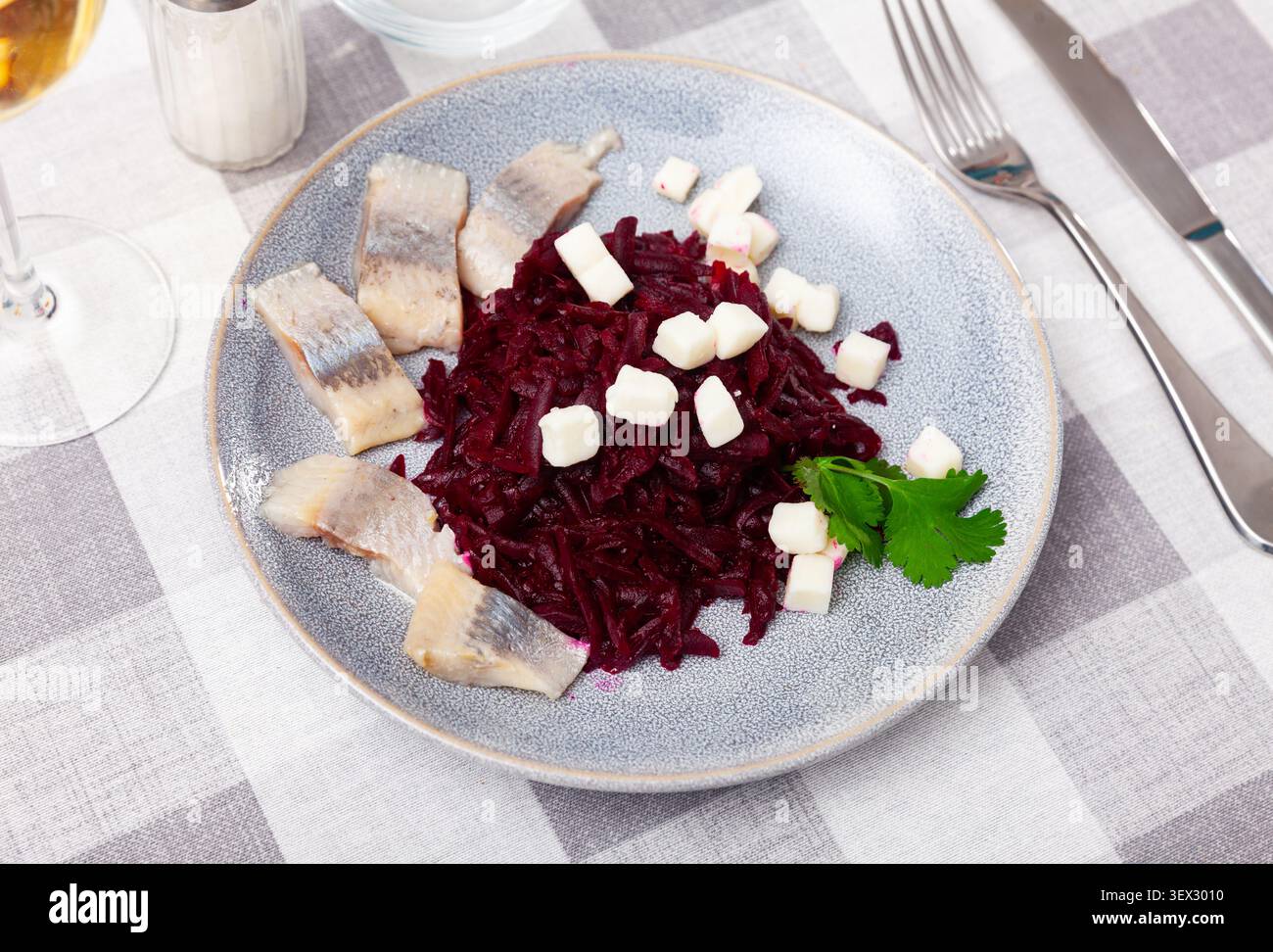 Beetroot served with cheese and pickled mackerel Stock Photo