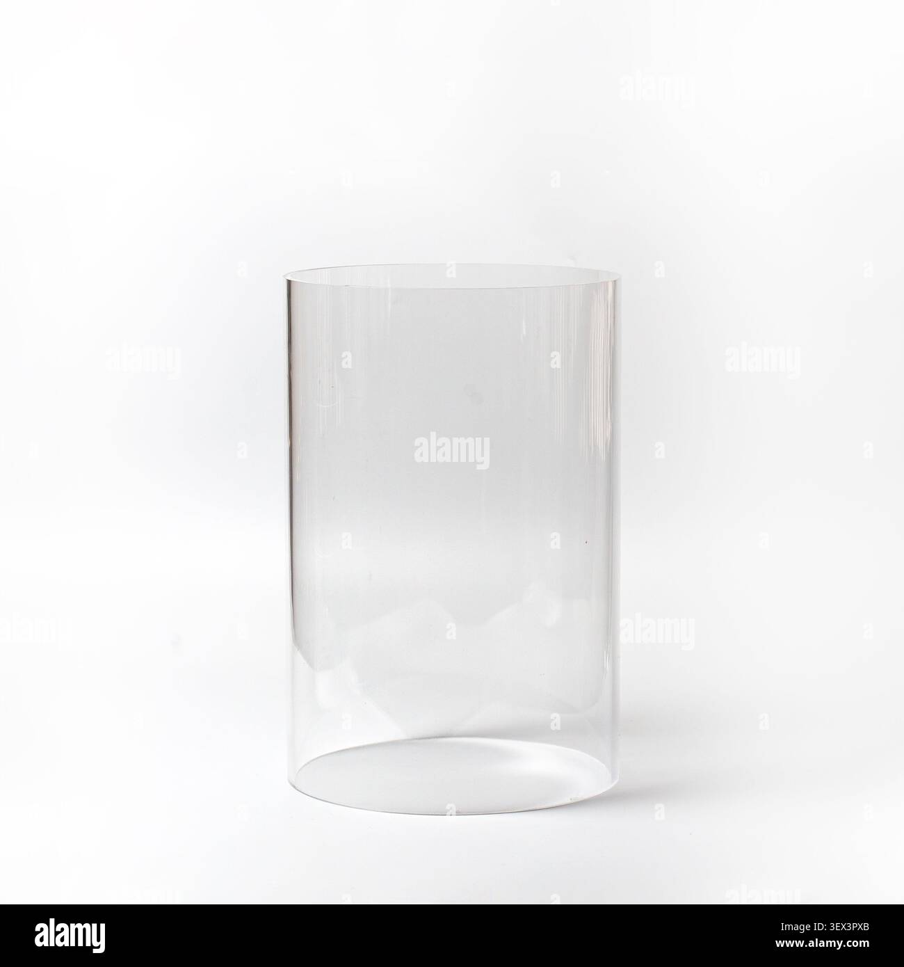 Empty clear plastic round display podium on white background studio front shot Stock Photo